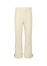 A product shot of the HOMME PLISSÉ ISSEY MIYAKE PLEATS BOTTOMS 2 trousers in ivory (41).