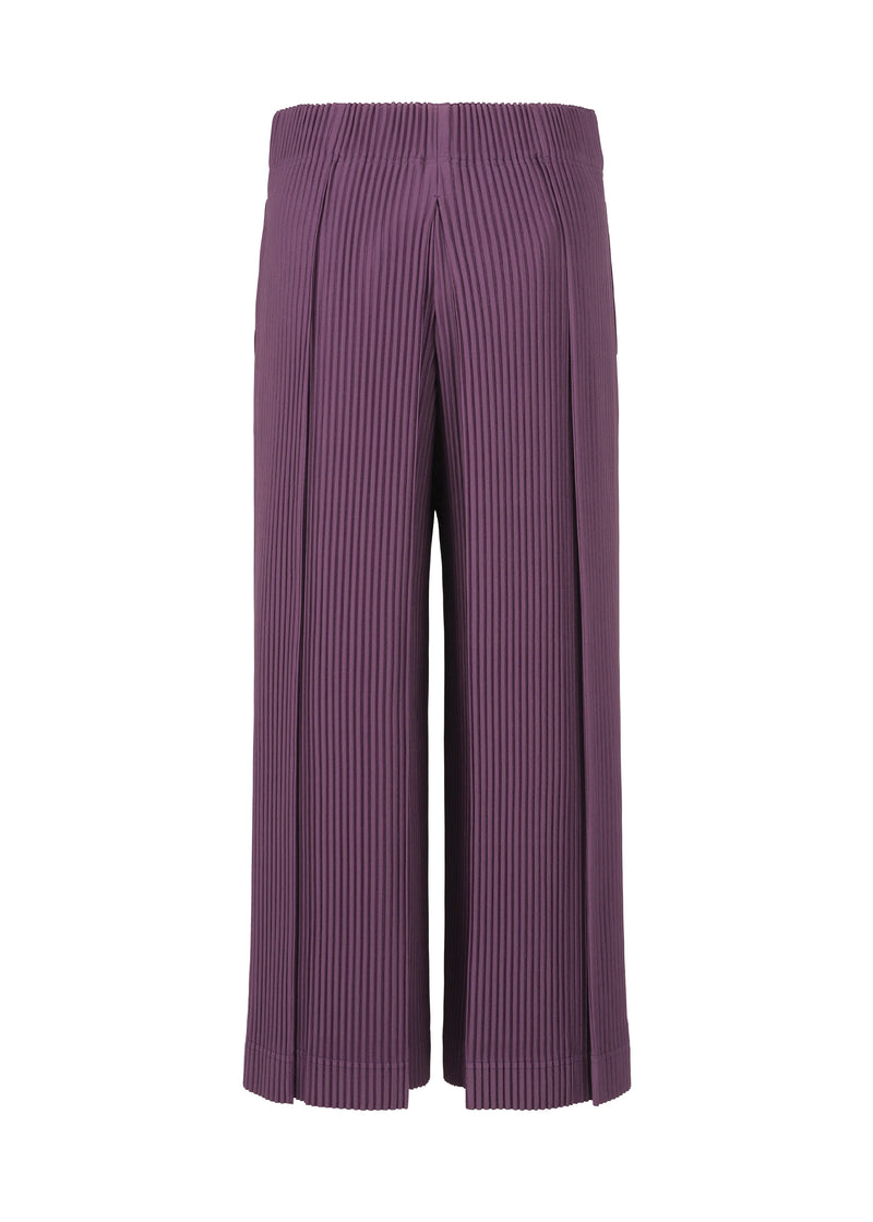 A detail shot of the HOMME PLISSÉ ISSEY MIYAKE  TUCKED trousers