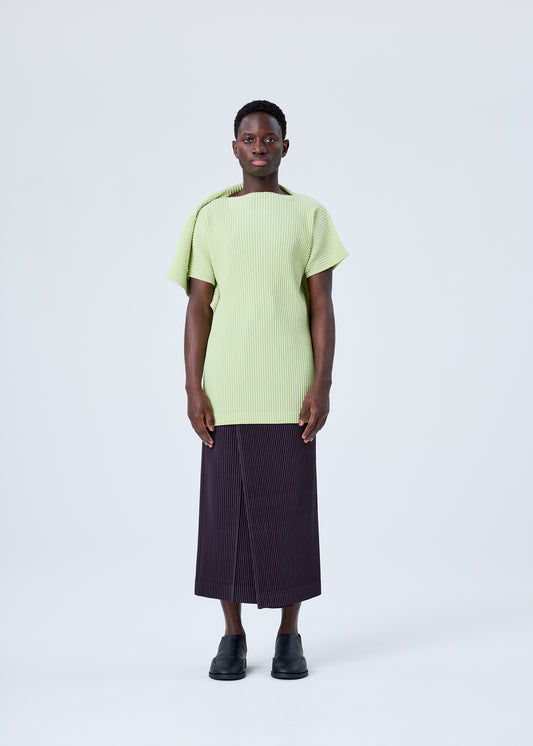 A model wears the HOMME PLISSÉ ISSEY MIYAKE RB_COLOR PALETTE 1 trousers