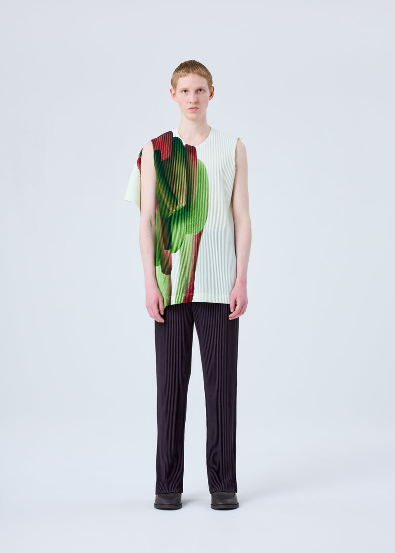 A model wears the HOMME PLISSÉ ISSEY MIYAKE RB_COLOR PALETTE 1 trousers