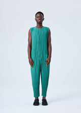 A model wears the HOMME PLISSÉ ISSEY MIYAKE PLEATS BOTTOMS 2 jumpsuit.