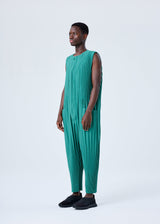 A model wears the HOMME PLISSÉ ISSEY MIYAKE PLEATS BOTTOMS 2 jumpsuit.