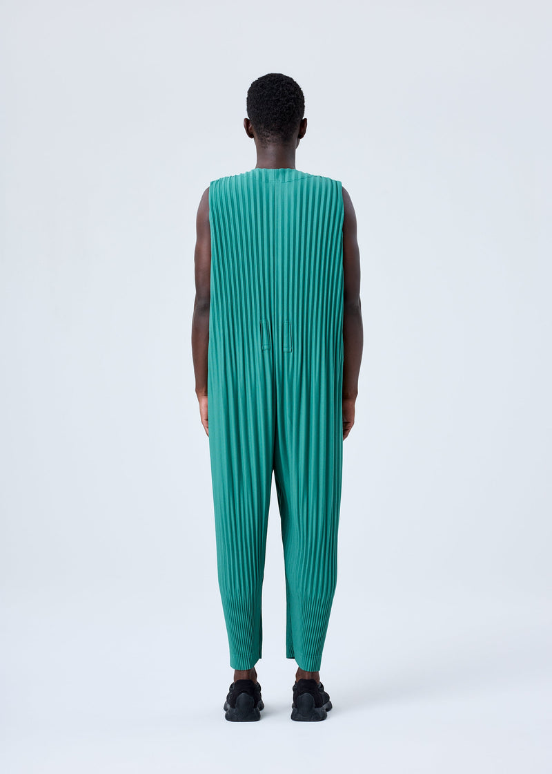 A model wears the HOMME PLISSÉ ISSEY MIYAKE PLEATS BOTTOMS 2 jumpsuit.