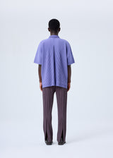 A model wears the HOMME PLISSÉ ISSEY MIYAKE  MC JULY shirt