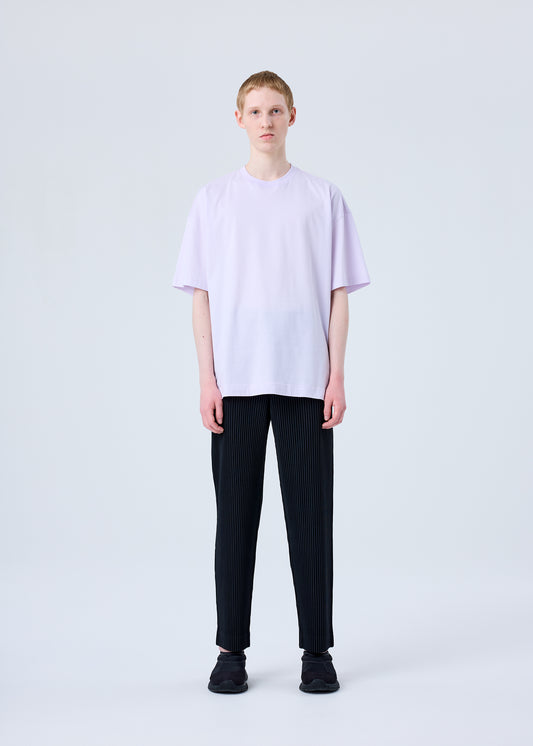 A model wears the HOMME PLISSÉ ISSEY MIYAKE RB_T SHIRT top