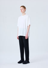 A model wears the HOMME PLISSÉ ISSEY MIYAKE RB_T SHIRT WB top