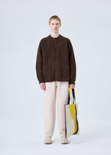 A model wears the HOMME PLISSÉ ISSEY MIYAKE RUSTIC KNIT jacket.