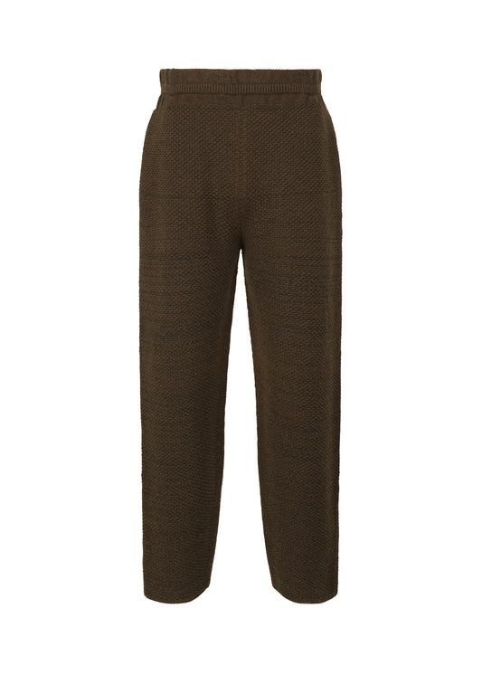 A product shot of the HOMME PLISSÉ ISSEY MIYAKE RUSTIC KNIT trousers in brown (44).