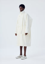A model wears the HOMME PLISSÉ ISSEY MIYAKE FRESHEN coat.