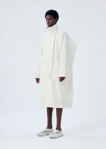 A model wears the HOMME PLISSÉ ISSEY MIYAKE FRESHEN coat.