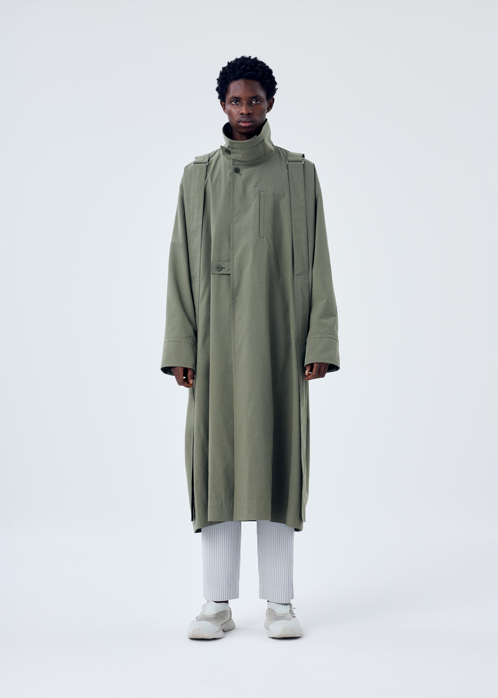 A model wears the HOMME PLISSÉ ISSEY MIYAKE PARACHUTE coat.