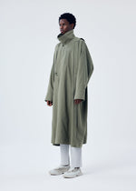 A model wears the HOMME PLISSÉ ISSEY MIYAKE PARACHUTE coat.