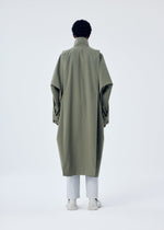 A model wears the HOMME PLISSÉ ISSEY MIYAKE PARACHUTE coat.