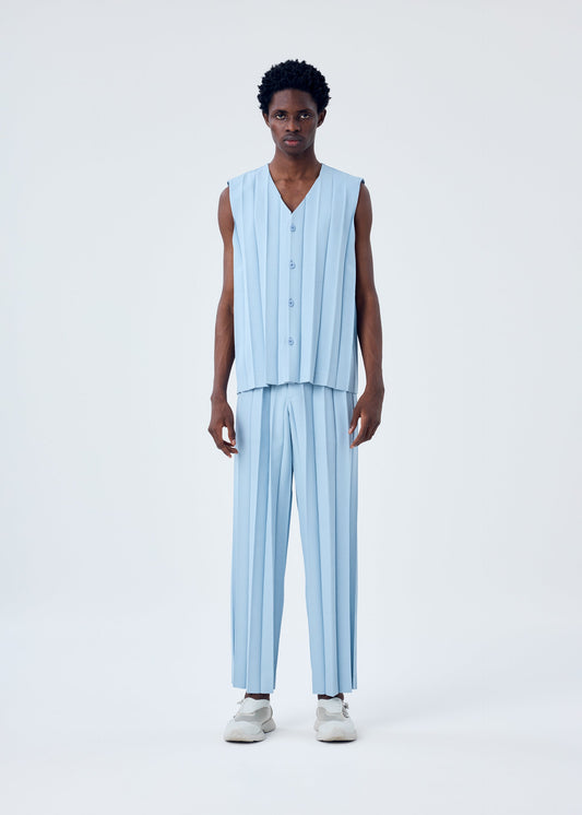 A model wears the HOMME PLISSÉ ISSEY MIYAKE EDGE ENSEMBLE trousers.