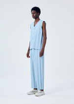 A model wears the HOMME PLISSÉ ISSEY MIYAKE EDGE ENSEMBLE trousers.