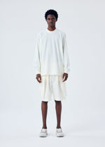 A model wears the HOMME PLISSÉ ISSEY MIYAKE FRESHEN trousers.