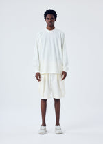 A model wears the HOMME PLISSÉ ISSEY MIYAKE FRESHEN trousers.