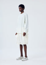 A model wears the HOMME PLISSÉ ISSEY MIYAKE FRESHEN trousers.