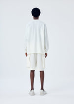A model wears the HOMME PLISSÉ ISSEY MIYAKE FRESHEN trousers.