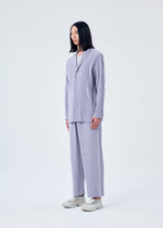 A model wears the HOMME PLISSÉ ISSEY MIYAKE TAILORED PLEATS 2 jacket.