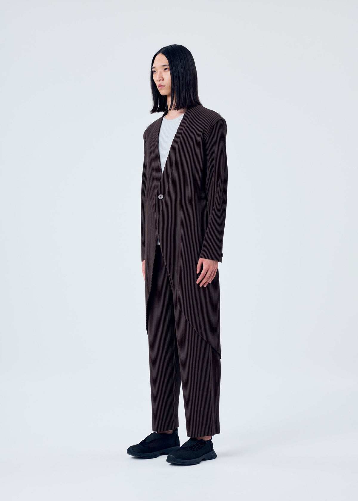A model wears the HOMME PLISSÉ ISSEY MIYAKE TAILORED PLEATS 2 jacket.