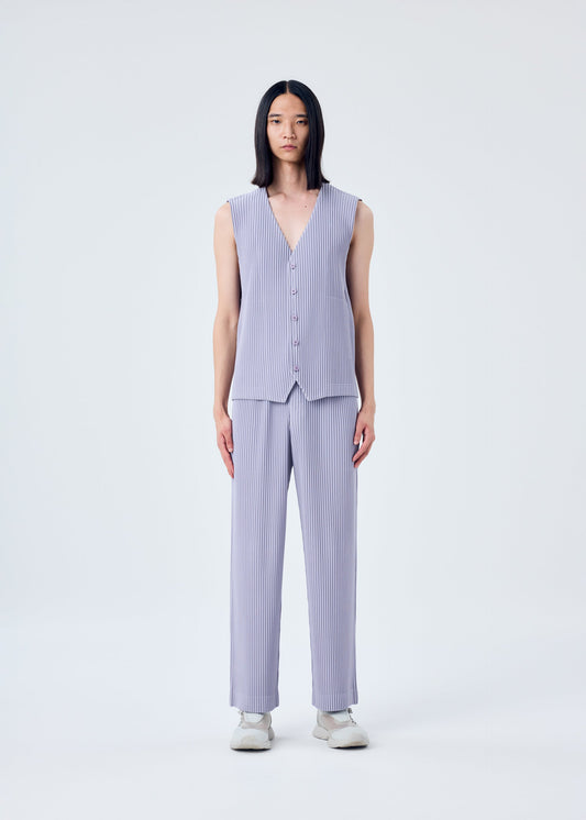 A model wears the HOMME PLISSÉ ISSEY MIYAKE TAILORED PLEATS 2 vest.