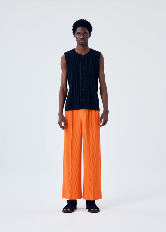 A model wears the HOMME PLISSÉ ISSEY MIYAKE MC FEBRUARY trousers.