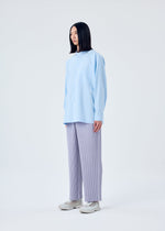 A model wears the HOMME PLISSÉ ISSEY MIYAKE TAILORED PLEATS 2 trousers.