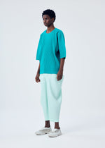 A model wears the HOMME PLISSÉ ISSEY MIYAKE KINETIC SCULPTURE trousers.