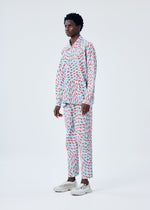 A model wears the HOMME PLISSÉ ISSEY MIYAKE WIND SPEED trousers.