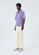 A model wears the HOMME PLISSÉ ISSEY MIYAKE WIND SPEED shirt.