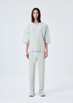 A model wears the HOMME PLISSÉ ISSEY MIYAKE MC MARCH top.