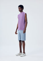 A model wears the HOMME PLISSÉ ISSEY MIYAKE MC APRIL top.