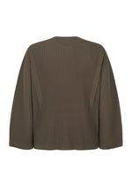 A detail shot of the HOMME PLISSÉ ISSEY MIYAKE TURBINE top.