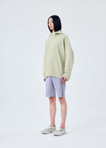 A model wears the HOMME PLISSÉ ISSEY MIYAKE MC MAY shirt.
