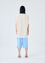 A model wears the HOMME PLISSÉ ISSEY MIYAKE TIGHT TWIST COTTON KNIT vest.