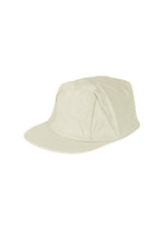 A product shot of the HOMME PLISSÉ ISSEY MIYAKE STONE CAP hat in limestone white.