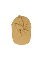 A detail shot of the HOMME PLISSÉ ISSEY MIYAKE STONE CAP hat.