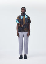 A model wears the HOMME PLISSÉ ISSEY MIYAKE AGATE SCARF stole.