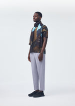 A model wears the HOMME PLISSÉ ISSEY MIYAKE AGATE SCARF stole.