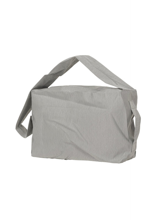 A product shot of the HOMME PLISSÉ ISSEY MIYAKE STONE BAG bag in silver grey (90).