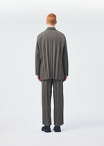 A model wears the HOMME PLISSÉ ISSEY MIYAKE EDGE ENSEMBLE jacket.