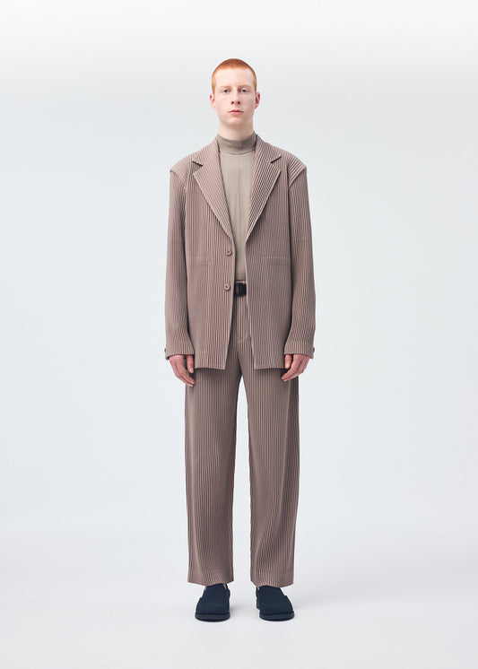 A model wears the HOMME PLISSÉ ISSEY MIYAKE KERSEY PLEATS jacket.