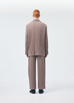 A model wears the HOMME PLISSÉ ISSEY MIYAKE KERSEY PLEATS jacket.