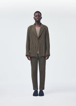 A model wears the HOMME PLISSÉ ISSEY MIYAKE WOOL LIKE LIGHT jacket.