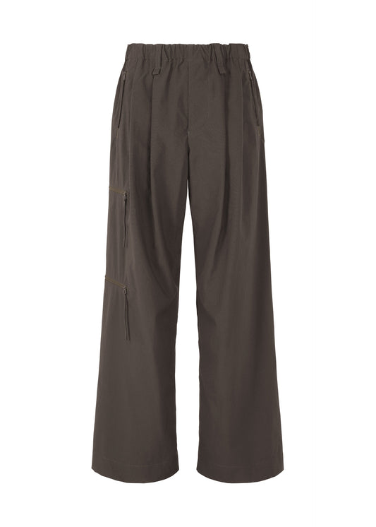 A product shot of the HOMME PLISSÉ ISSEY MIYAKE QUARRY PANTS trousers in dark brown (49).