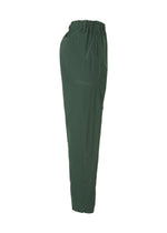 A detail shot of the HOMME PLISSÉ ISSEY MIYAKE QUARRY PANTS trousers.