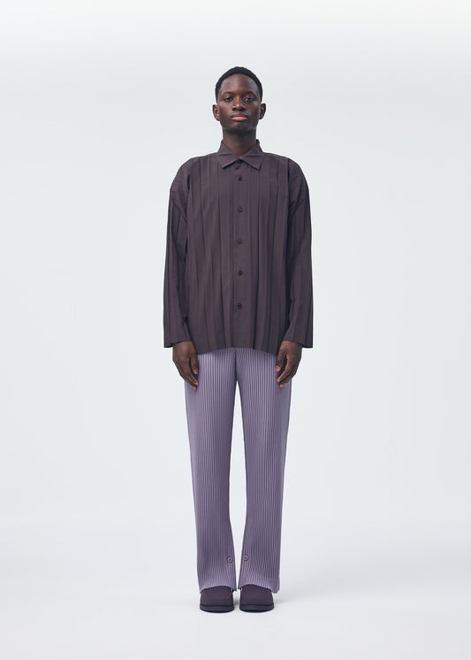 A model wears the HOMME PLISSÉ ISSEY MIYAKE EDGE SHIRT shirt.
