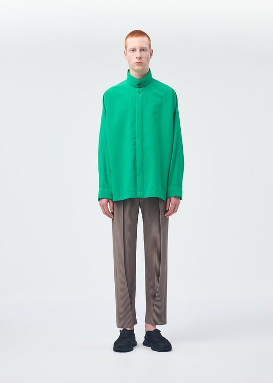 A model wears the HOMME PLISSÉ ISSEY MIYAKE PADDED RIM SHIRT shirt.