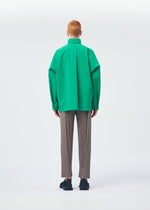 A model wears the HOMME PLISSÉ ISSEY MIYAKE PADDED RIM SHIRT shirt.